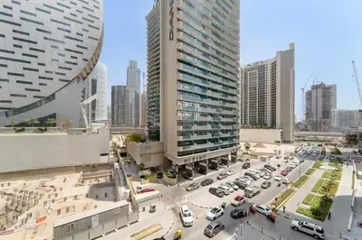 a city with cars parked in a parking lot at ALiving Classy 1BR I Near Burj Khalifa & Dubai Mall I Missoni Tower- 211 in Dubai