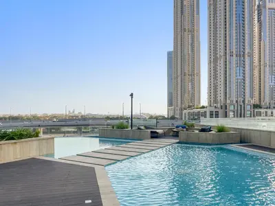 a swimming pool in a city with tall buildings at ALiving Classy 1BR I Near Burj Khalifa & Dubai Mall I Missoni Tower- 211 in Dubai
