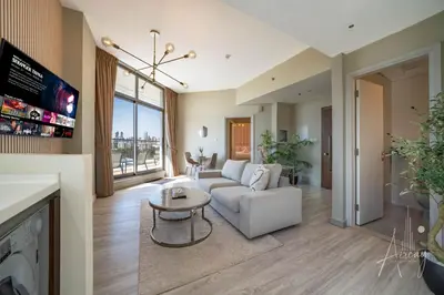 a living room with a couch and a table at Burj Khalifa View Big terrace 1BR in Prime Views in Dubai
