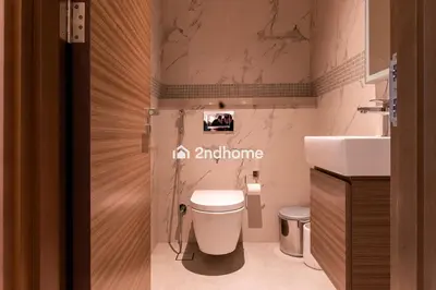 a bathroom with a toilet and a sink at Fully Equipped Residence at One Park Avenue in Dubai