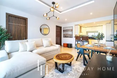 a living room with a couch and a table at LUX The Bonnington JLT Suite 2 in Dubai