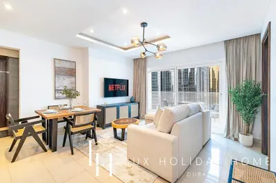 a living room with a couch and a table at LUX The Bonnington JLT Suite 2 in Dubai