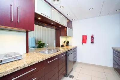 a kitchen with a sink and a counter top at Lovely 1BHK in Burj views tower near Dubai mall in Dubai