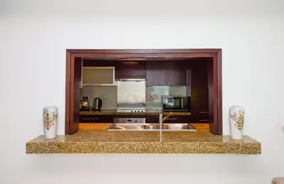 a kitchen with a sink and a counter top at Lovely 1BHK in Burj views tower near Dubai mall in Dubai