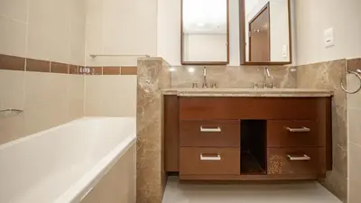 a bathroom with a tub and a sink and a bath tub at Burj and fountain view 3BHK Near Dubai Mall in Dubai