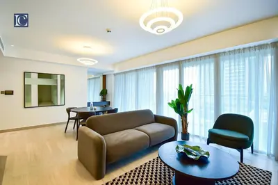 a living room with a couch and a table at Luxury Escapes - ME DO RE Tower JLT in Dubai