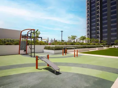 a park with a playground with a swing at SettlerHomes - Serene Golfville Escape near Parkside in Dubai