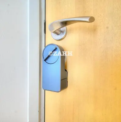 a door handle on a wooden door at Business Bay Retreat in Dubai
