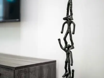 a metal chain hanging next to a wooden table at Exceptional 1Bedroom with Premium Amenities in Dubai