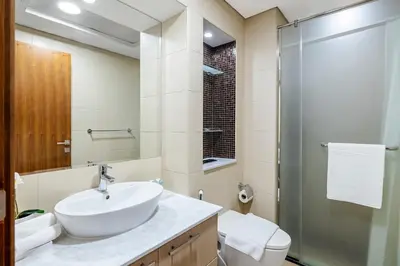 a bathroom with a sink and a shower at 2BR City View Bay Square B13 in Dubai