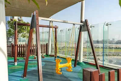 a playground in a building with a swing at Dubai Paramount 1BR APT Burj Khalifa view in Dubai
