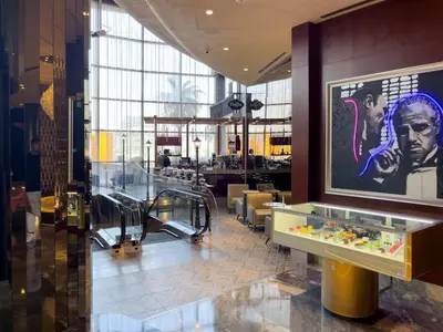 a lobby of a building with a large window at Dubai Paramount 1BR APT Burj Khalifa view in Dubai