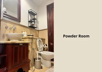 a bathroom with a sink and a toilet and a mirror at 5 Min Walk to Burj Khalifa 2BHK Luxury Downtown Burj Haven in Dubai