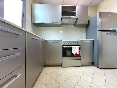 a kitchen with stainless steel appliances and a stove at Luxury Studio w Marina View & New Furnishings for 4 Pax in Dubai