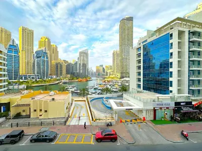a view of a city with a river and buildings at Luxury Studio w Marina View & New Furnishings for 4 Pax in Dubai