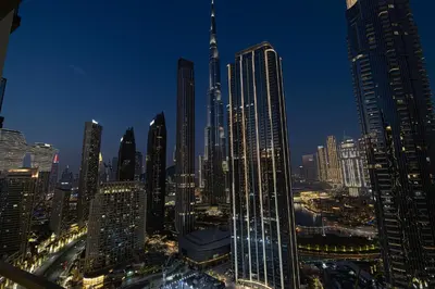 a view of a large city at night at Luxury High Floor Apartment with Downtown Boulevard View Opposite Dubai Mall in Dubai