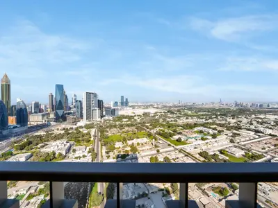 a view of a city skyline from a balcony at BRAND-NEW 1BR in DOWNTOWN I Direct DUBAI MALL Access I Balcony & Stunning Pool in Dubai