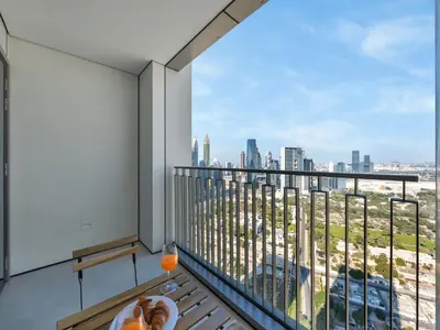 a balcony with a view of a city skyline at BRAND-NEW 1BR in DOWNTOWN I Direct DUBAI MALL Access I Balcony & Stunning Pool in Dubai