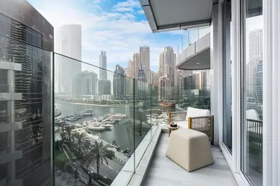 a balcony with a view of a harbor at Luxe Central Marina Studio with Rooftop Pool in Dubai