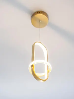 a gold and white light fixture hanging from a ceiling at Luxury 1BR, 5 Min walk to Dubai Mall & Burj Khalifa, Can Sleep 1-4 in Dubai