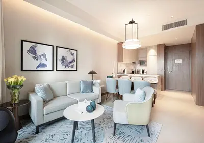 a living room with a couch and a table at Luxurious 2BR at Address Opera with Boulevard Views in Dubai