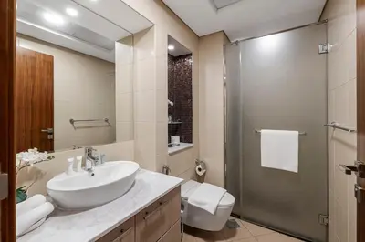 a bathroom with a sink and a shower at 1BR with Study City View Bay Square in Dubai