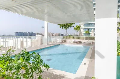 a swimming pool on the roof of a building at GuestReady - Blue Diamond Beachfront Retreat in Dubai
