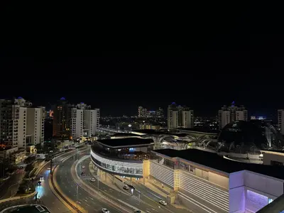 a view of a city at night with traffic at Hight-floor Studio Atlantis view in Dubai