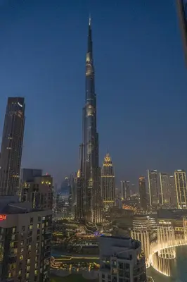 a view of a city skyline with a tall building at Downtown Gem, Full Burj Khalifa & Dubai Fountain Views, Luxury Amenities in Dubai