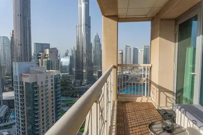 a balcony with a view of a city at Downtown Gem, Full Burj Khalifa & Dubai Fountain Views, Luxury Amenities in Dubai