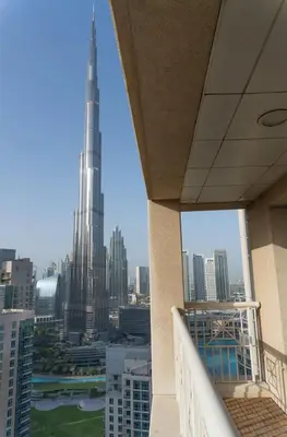 a view of the burj khalifa from a balcony of a building at Downtown Gem, Full Burj Khalifa & Dubai Fountain Views, Luxury Amenities in Dubai