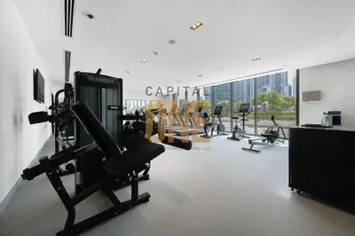 a gym with cardio equipment in a large room at Burj Khalifa View, Pool, Parking, 1BR, Downtown Dubai, Modern Furnished in Dubai