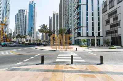 a street in a city with tall buildings at Burj Khalifa View, Pool, Parking, 1BR, Downtown Dubai, Modern Furnished in Dubai