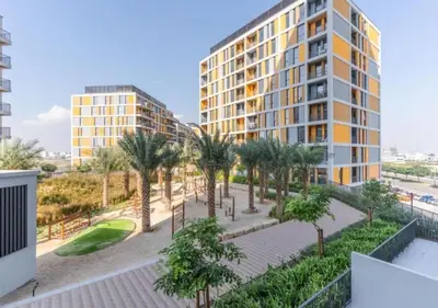 an aerial view of a building with palm trees at Classy 1BR in Midtown Access All Dubai Spots by Vibel in Dubai