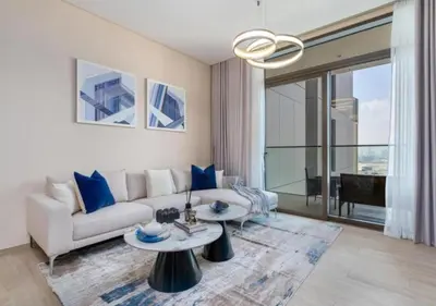 a living room with a couch and a table at Stylish 1BR w City Views Palace Creek Harbour by Vibel in Dubai