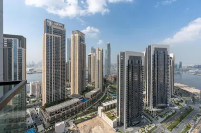an aerial view of a city with tall buildings at Stylish 1BR w City Views Palace Creek Harbour by Vibel in Dubai