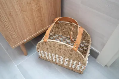 a basket sitting on the floor next to a cabinet at Cozy 1BR Midtown 20 Mins to Mall of Emirates by Vibel in Dubai