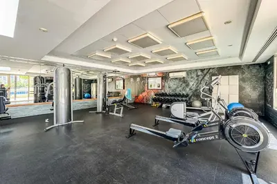 a gym with a treadmill and a bike in a room at 1BR The Greens Courtyard View in Dubai
