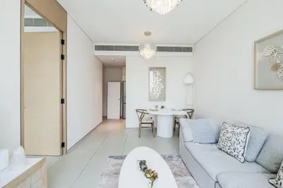 a living room with a couch and a table at Luxury at JBR Jumeirah Gate Tower 1 1 Bed in Dubai