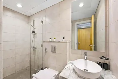 a bathroom with a sink and a shower at Brand new Business Bay location in Dubai