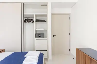 a bedroom with a bed and a closet at Silkhaus Marina View 1BDR Marina Vista Tower in Dubai