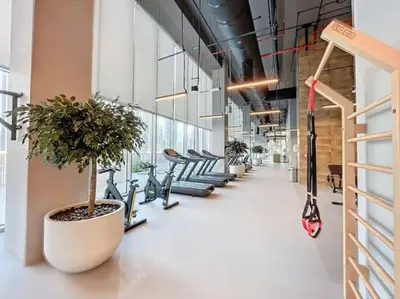 a row of exercise bikes lined up in a hallway at 3BR Burj Khalifa Fountain Views Forte 1- 18th floor in Dubai