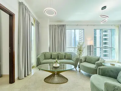 a living room with a couch and a table at Golden homes Residences Tower 05 1BR CITY VIEW Near Dubai mall & burj khalifa in Dubai