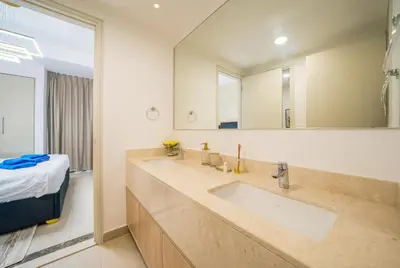 a bathroom with a sink and a mirror at NewArabian Dubai HillsMaple Villa in Dubai