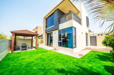 a house with a large yard with green grass at NewArabian Dubai HillsMaple Villa in Dubai