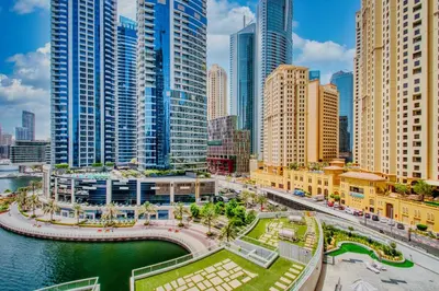 a city with tall buildings and a body of water at Aesthetic 2BR with Marina Waterfront View in Dubai