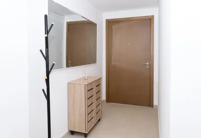 a bathroom with a wooden dresser and a mirror at Stunning 2 Bedroom Apartment Downtown Views 2 - Tower 3 Downtown Dubai in Dubai