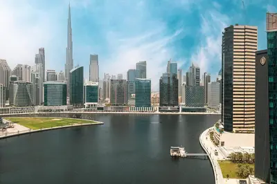 a view of a large city with a body of water at Sukoon's Waterfront Two-Bedroom in Dubai