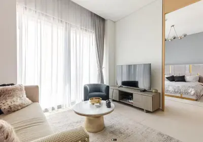 a living room with a couch a table and a bed at Premium Stay at The Address Residences JBR in Dubai