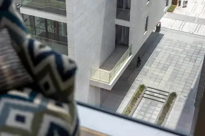 a man standing in front of a building at 2BR plus M with Huge Balcony City Walk Building 22 in Dubai